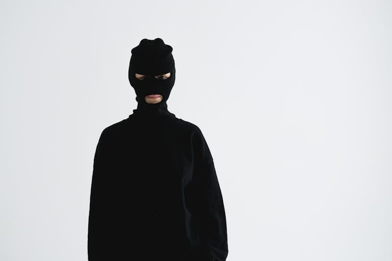 Portrait of an unrecognizable person in a balaclava, exuding a sense of mystery and anonymity.